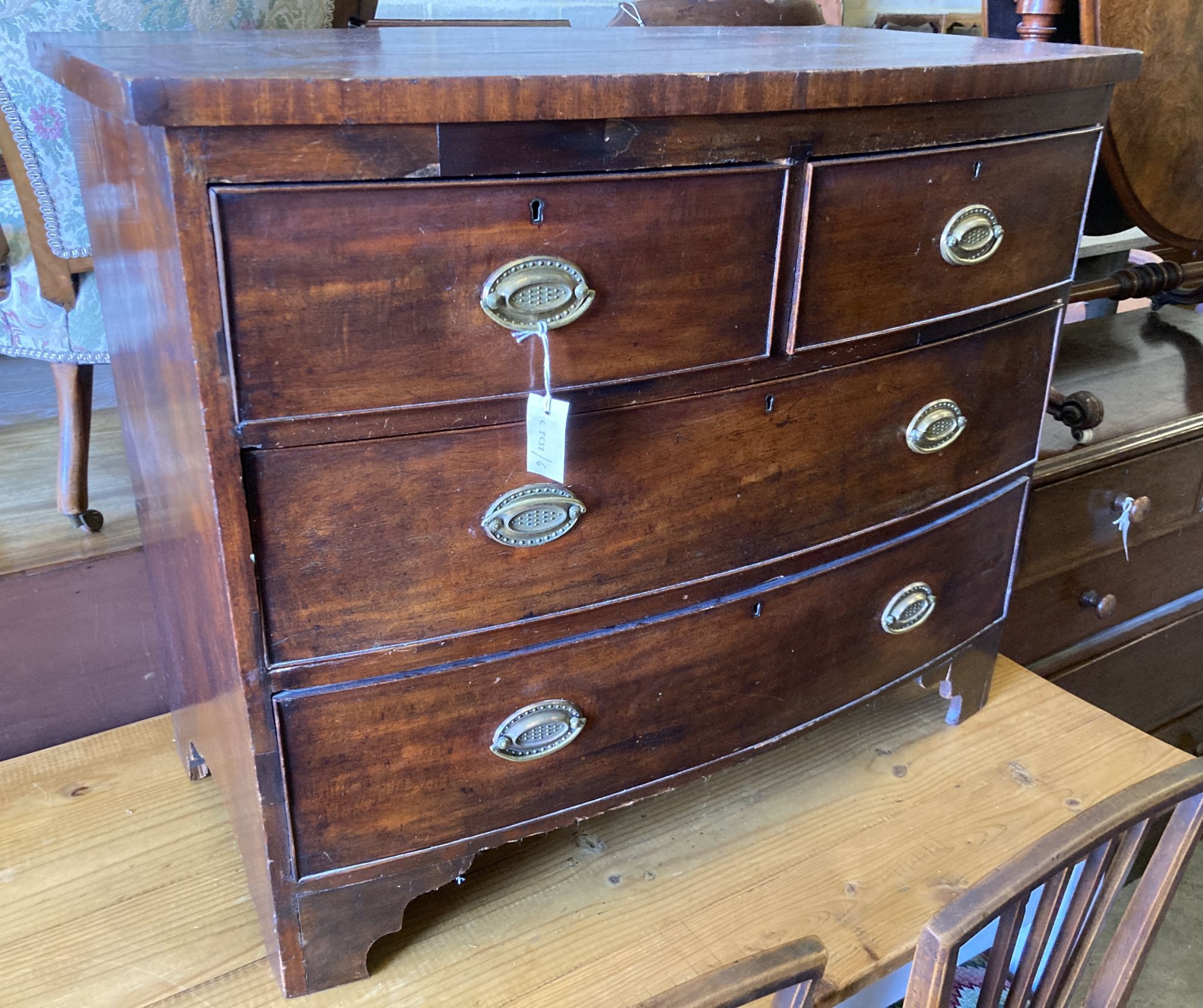 A Regency mahogany bow front chest of drawers, with brass handles, width 101cm, depth 52cm, height 82cm